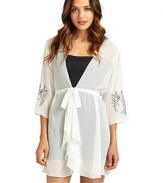 THE LOOKTailored from sheer georgetteWrap front with button closureFront tie waistThree-quarter length sleeves with floral embroidered cuffsTHE FITAbout 33 from shoulder to hemTHE MATERIALPolyesterCARE & ORIGINMachine washImported