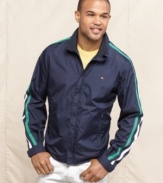 Improve your look off the tee with this striped golf windbreaker from Tommy Hilfiger.