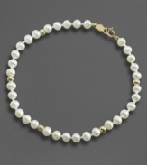 Everyday elegance, fit for any age. This lovely simulated pearl bracelet is accented with 14k gold beads.