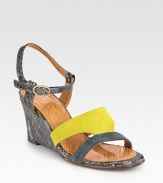 Textured, snake-embossed leather wedge features colorblocked suede straps and an adjustable slingback. Snake-embossed leather-covered wedge, 3 (75mm)Suede and embossed leather upperLeather lining and solePadded insoleMade in SpainOUR FIT MODEL RECOMMENDS ordering one size up as this style runs small. 