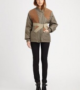 Channel the runway in this quilted coat with contrasting suede trim and a detachable corset panel for a dose of countryside-cool. Ribbed asymmetrical collarAsymmetrical zipperDetachable crossover panelLong sleevesRibbed cuffs and hemFully linedAbout 27 from shoulder to hemBody: 100% nylonTrim: Cotton/acrylic/suedeDry clean with leather specialistImportedModel shown is 5'10 (177cm) wearing US size 4. 