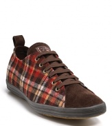 A low-profile sneaker from Paul Smith, centered on a rich plaid upper with leather tongue and toe.