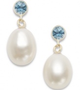 Polish, shine & poise. These glam drop earrings highlight cultured freshwater pearls (8-1/2-9mm) and round-cut blue topaz in a stud backing (5/8 ct. t.w.). Earrings crafted in 14k gold. Approximate drop: 3/4 inch.