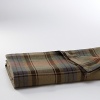 A richly textured bed blanket is basket-woven from soft cotton for a sumptuous feel and finished in a handsome large-scale plaid pattern for a heritage look.