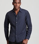 Urbane sophistication is embodied in a navy woven slim fit shirt from Theory.