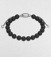 From the Spiritual Bead Collection. Rich black onyx beads are accented by polished sterling silver.Black onyx Sterling silver Width, about 8mm Diameter, about 2 Adjustable clasp Imported