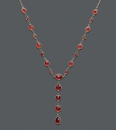 Ignite a flame with bold color along your neckline. This dramatic v-shaped necklace features brilliant oval-cut, round-cut, and pear-cut garnet (8-5/8 ct. t.w.) in a 14k gold setting. Approximate length: 17 inches. Approximate drop: 1-1/2 inches.