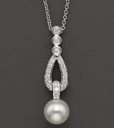 A pearl drop pendant is dropped from a diamond-accented teardrop design.