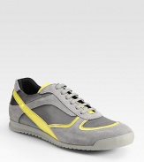 Sport around town in style in this lace-up sneaker crafted of fine canvas and leather.Padded insoleRubber soleImported