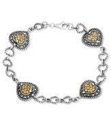 Hearts are in the right place on this bracelet from Genevieve & Grace. Crafted from sterling silver, the bracelet features marcasite and champagne crystal hearts for a lustrous touch. Approximate length: 7 inches. Approximate width: 1/2 inch.