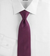 An elegant Italian silk design is finished with tiny dots allover. Silk Dry clean Made in Italy 