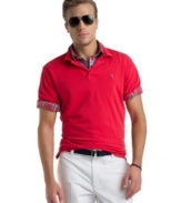 Bright spot. With a cool saturated color, this Izod polo shirt will be an instant favorite.