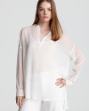 An ethereal Vince tunic is sheer genius, flowing loosely over chic wardrobe separates for haute getaway style.