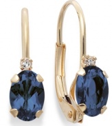 Sparkling perfection. Add a vibrant pop of color to your look with oval-cut sapphires (9/10 ct. t.w.) and sparkling diamond accents. Crafted in a 14k gold leverback setting. Approximate drop: 3/4 inch.