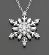 Round-cut and baguette-cut diamonds (1/5 ct. t.w.) make this snowflake shape glitter like fresh snow. Set in 14k white gold. Chain measures 16 inches.