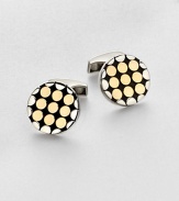 A handsome pair of sterling silver and 18kt-gold cuff links instantly adds modern artistry to your standard dress wardrobe.Sterling silver/18kt GoldAbout ¾ diam.Made in the United Kingdom