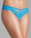 A eyelet lace thong with wide sides and contrasting bow on front.