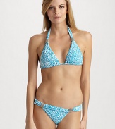 Lively abstract graphics mimic the ocean scene on this halter triangle style, with silvery bead accents.Halter straps tie at the neck Adjustable cups Back tie closure Fully lined 85% Meryl nylon/15% spandex Fully lined Hand wash ImportedPlease note: Bikini bottom sold separately. 