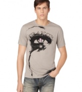 A cool graphic of an eye with a skull pupil and trance printed above, gives this Calvin Klein Jeans tee its edgy artsy style.