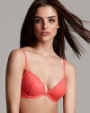 Feel supported yet sexy with this allover lace push-up bra with a bow at the center front.