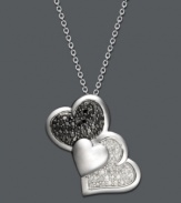 This Treasured Hearts design puts a modern twist on the iconic heart symbol. Three, overlapping hearts shine with the addition of round-cut black diamonds (1/5 ct. t.w.) and white diamonds (1/6 ct. t.w.). Setting and chain crafted in sterling silver. Approximate length: 18 inches. Approximate drop: 1 inch.