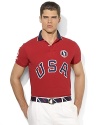 Cut for a trim, modern fit from breathable cotton mesh, a short-sleeved polo shirt is accented with bold country embroidery, celebrating Team USA's participation in the 2012 Olympic Games.