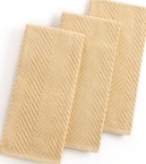 Grab style and keep function with a set of three kitchen towels that step forward in a calm color to wipe up spills, aid in prep and add an accent to your space. The textured design sets a sharp appearance for any room, while the highly absorbent terry quickly cleans up. Limited lifetime warranty.