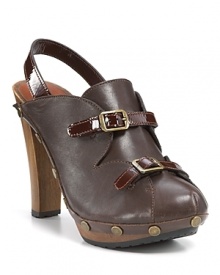 Glossy patent trim and scalloped accents lend ladylike appeal to these See by Chloé clogs.