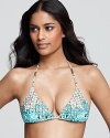 A teal ikat print bands together with a vintage-inspired floral on this vacation-ready Ella Moss bikini top.