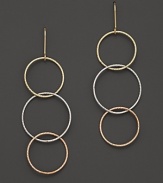 Interlocking tri-color hoop earrings in 14K gold evoke bohemian elegance. From Lana.