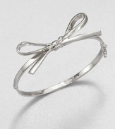 A sweet piece featuring a structured bow design. Rhodium-plated brassDiameter, about 2Hinged closureImported 