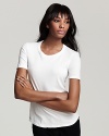 Get back to basics is this James Perse fitted white tee. The super soft crew neck shirt is a must-have staple for every woman's wardrobe.