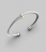 From the Cable Classics Collection. A signature Yurman sterling silver cable, richly adorned in the center with a textured band of 14k gold. Sterling silver & 14k yellow gold Cable, 5mm Diameter, about 2¼ Made in USA