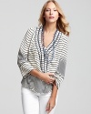 Exude breezy elegance with this striped Tory Burch silk blouse, designed in a fluid silhouette with a unique double-trim neckline and chic three quarter sleeves.