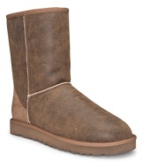 The signature pull-on boot from UGG® in distressed sheepskin leather with suede heel guard.