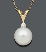 Perfection in the form of a timeless classic. A single cultured freshwater pearl (8-9 mm) with a sparkling diamond accent at the bail looks pristine suspended from a delicate 14k gold setting. Approximate length: 18 inches. Approximate drop: 1/2 inch.