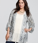 A miniature floral pattern pairs up with an eyelet insert to create this wispy-feeling Johnny Was Collection tunic. Imagine its possibilities: graceful with a slim skirt, or easygoing with jeans.