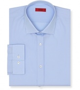 Slim fit shirt with spread collar. Square cuffs with two buttons to resize width. Clean front, no pocket. Back yoke with two darts.