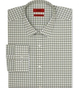 A slim-fit HUGO dress shirt touts traditional barrel cuffs and a check pattern for streamlined office polish.