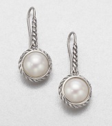 Luminous pearl drops, suspended from and framed by sterling silver cables. White pearls Sterling silver Drop, about ½ Ear wire Imported