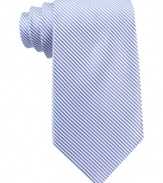 A fine stripe adds modern detail to this smooth silk tie from Nautica.