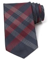 Burberry London preserves its heritage with a sophisticated signature check tie, crafted for a classic look that pairs well dressed up or down.