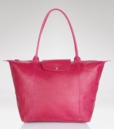 A bright alternative to black, Longchamp's fuchsia leather tote lends color-pop luxe to your purse portfolio. The smooth bag is prime to carry must-haves on the town or during weekend getaways.