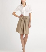 A crisp poplin skirt featuring a flattering silhouette and a self-tie belt that creates an ultra-feminine bow.Self-tie bow beltPleated front centerConcealed back zipperAbout 23 longCottonDry cleanImported Model shown is 5'11 (180cm) wearing US size 4. 