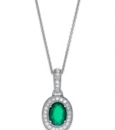 Make a sparkling impact with this pretty pendant. Set in sterling silver, an oval-cut green agate (1-1/10 ct. t.w.) glows against a halo of round-cut diamonds (1/4 ct. t.w.). Approximate length: 18 inches. Approximate drop: 1/2 inch.