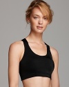 Get the comfort and support you need in this criss cross strap sports bra from Fashion Forms. Includes an inside pocket to carry keys or cell phone too!