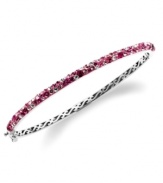 Slim, stackable style. Kaleidoscope's thin shimmering bangle makes a statement all its own, but can also be stacked with similar styles for a trendy layered look. Features round-cut fuchsia, light rose and white confetti crystals with with Swarovski Elements. Set in sterling silver. Bracelet features a hinge clasp. Approximate diameter: 2-1/2 inches.