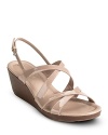 A strap-happy platform sandal in shiny patent. From Cole Haan.