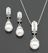 The perfect pairing. This matching set features a graceful pendant and pair of stud earrings that highlight a cultured freshwater pearl (7-8 mm) with round-cut diamond accents for a classic touch. Set in sterling silver. Approximate chain length: 18 inches. Approximate pendant drop: 1/2 inch.