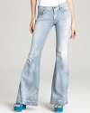 Railroad stripes lends a utilitarian feel to these Citizens of Humanity flare jeans, finished with frayed hems.